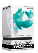 The Butterfly Effect Silicone Dual Motor Vibrator Teal packaging showcasing its design and features.