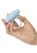 Pleasure Kits Honeymoon Collection silicone pleasure ring held in hand for enhanced intimate experiences.