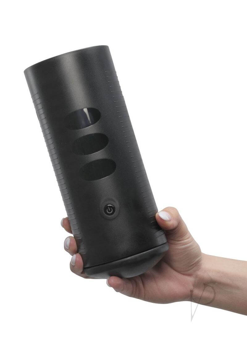 Hand holding the Titan by Kiiroo, a black handheld stroker with touch-sensitive vibration technology.