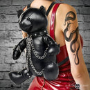 Master Series BDSM Bear Backpack Black worn on a model featuring a bear in bondage gear with chains and soft black finish.