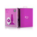b-Vibe Novice Remote-Controlled Vibrating Anal Plug Fuchsia packaging with remote and anal plug features.