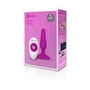 b-Vibe Novice Remote-Controlled Vibrating Anal Plug Fuchsia packaging with instructions and remote control.