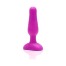 b-Vibe Novice Remote-Controlled Vibrating Anal Plug Fuchsia displayed on a reflective surface.