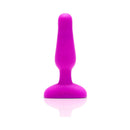 b-Vibe Novice Remote-Controlled Vibrating Anal Plug Fuchsia displayed on a reflective surface.