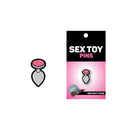Wood Rocket Gem Butt Plug Soft Enamel Lapel Pin featuring a sparkly design on a fun packaging.