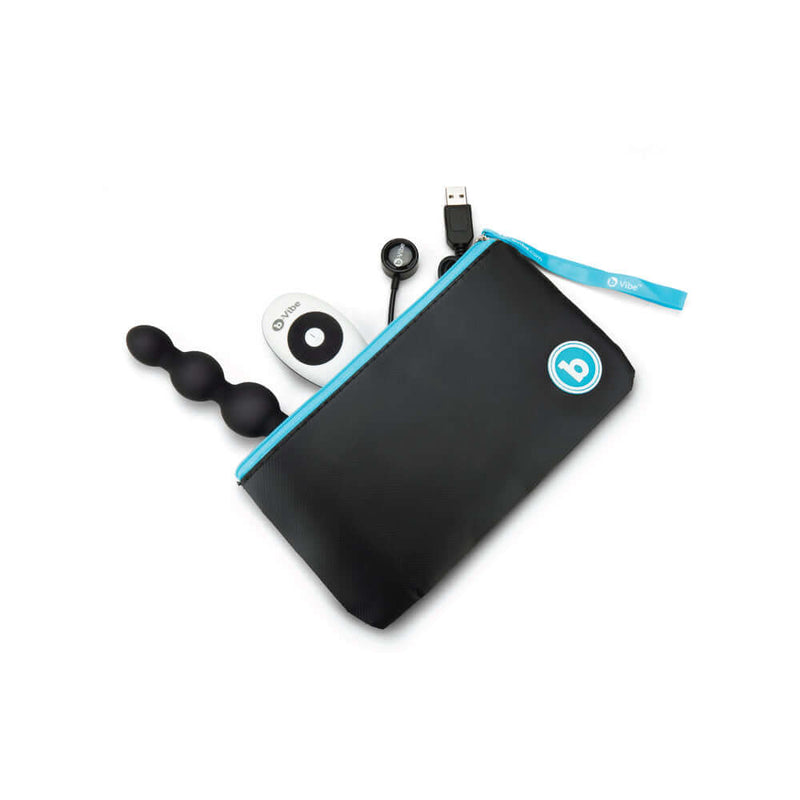 b-Vibe Triplet Remote Controlled Anal Beads Plug Black with remote and charging cable in a zippered pouch.