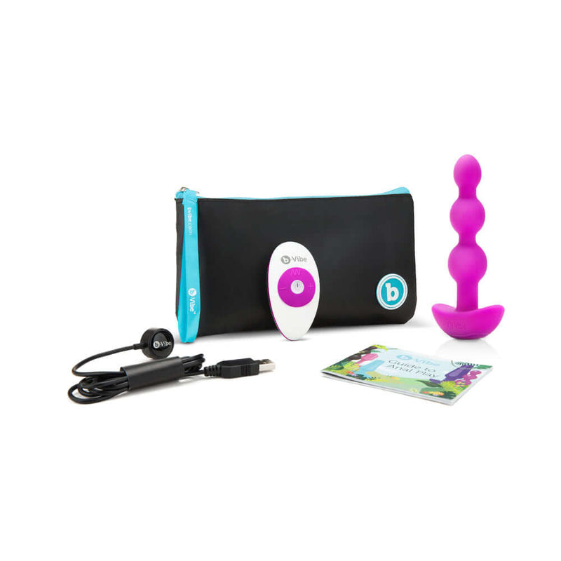 b-Vibe Triplet Remote Controlled Anal Beads Plug Fuchsia with remote, charging cable, and travel pouch.
