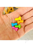 Colorful penis-shaped candy from Candyprints Suck A Bag Of Dicks Candy Display 100 Bags in a hand.
