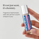 Pure Instinct Pheromone Perfume Oil Roll-on Crave 0.34 Oz held in hand with text about unique scent.