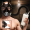Master Series Overload Stroker Gas Mask Kit displayed with a male model wearing the gas mask and holding a bottle.