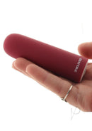 Evolved Mighty Thick Rechargeable Bullet Vibrator Red held in a hand, showcasing its compact and powerful design.
