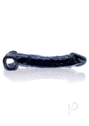Oxballs Muscle Ripped Cocksheath Extender Black on a reflective surface, showcasing its sleek design.
