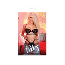 Fuck Off Lace Bra & Cutout Panty M/L Black displayed with vibrant background and model showcasing bold lingerie design.