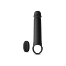 Renegade Brute Vibrating Penis Extension Black next to its control for enhanced intimate experiences.