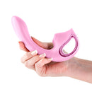 Seduction Kaia Metallic Pink Air Pulse Rabbit Vibrator being held in a hand, showcasing its sleek design and features.