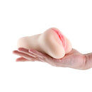 Hustler's Barely Legal Elle Stroker White held in a hand, showcasing its lifelike design and textured shaft.