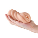 Hustler's Barely Legal Carrie Stroker Tan held in a hand, showcasing its realistic design and compact size.