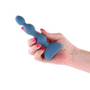 Hand holding the Secrets Kai Vibrating Anal Plug Dark Teal, highlighting its sleek design and comfortable grip.