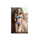 Plur Holographic Aqua Bralette Hood Panty Set S/M displayed on model in outdoor setting, showcasing vibrant colors and design.