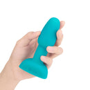 b-Vibe Rimming Petite Rotating and Vibrating Remote Control Plug Teal held in hand, showcasing its smooth design.