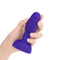 b-Vibe Rimming Petite Rotating Remote Control Plug Purple in hand, showcasing its small size and design.