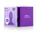 b-Vibe Rimming Petite Rotating Remote Control Plug Purple packaging displayed with its remote.