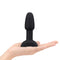 b-Vibe Rimming Petite Rotating and Vibrating Remote Control Plug Black held in a hand for size reference.