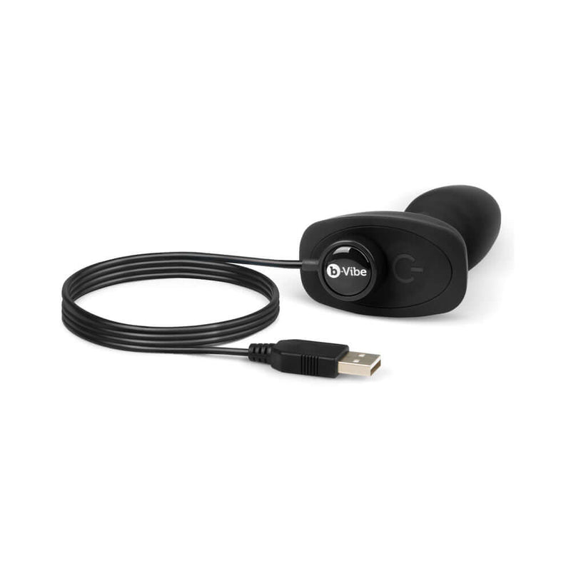 b-Vibe Rimming Petite Rotating and Vibrating Remote Control Plug Black with remote and USB charging cable.