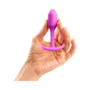 b-Vibe Snug Plug 1 Weighted Silicone Anal Plug Fuchsia held in a hand, showcasing its compact design.