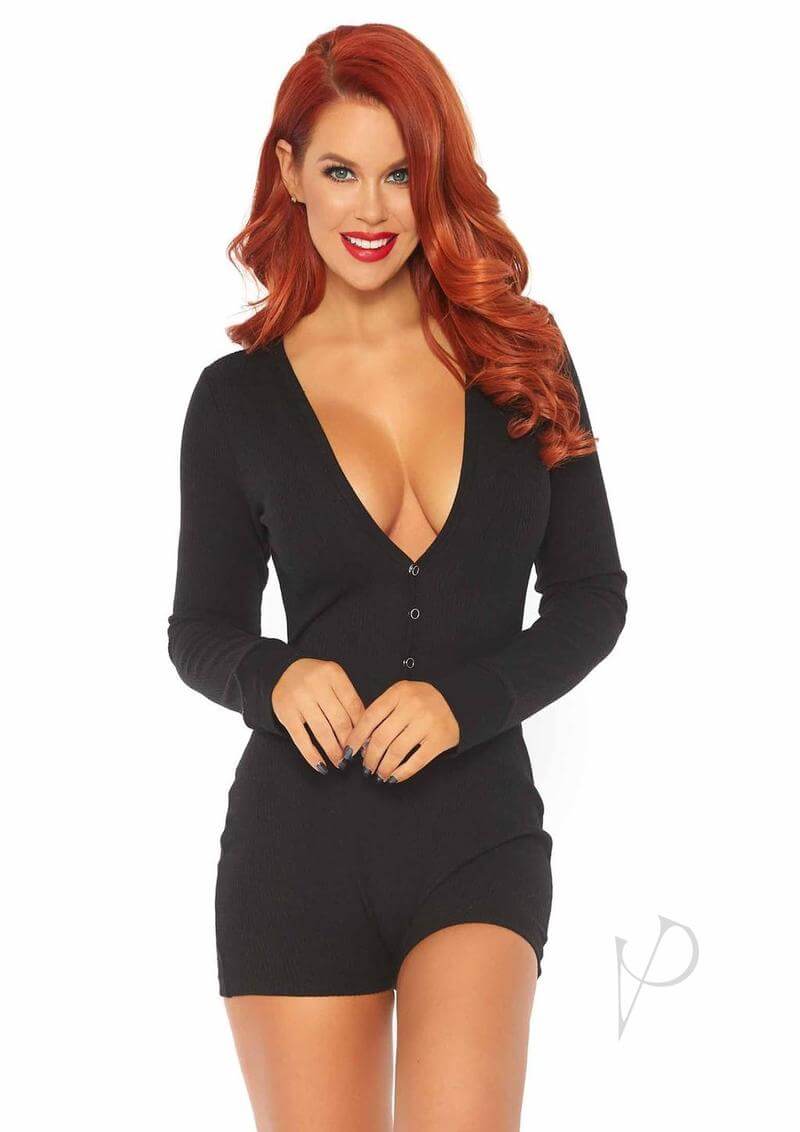 Woman wearing black romper with deep-V neckline and long sleeves, showcasing stylish loungewear with playful back flap detail.