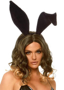 Leg Avenue Bendable Velvet Bunny Ears One Size Black on a model with styled hair, showcasing playful costume accessory.