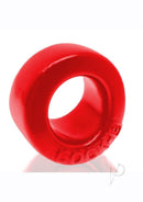 Oxballs Cock-B Bulge Silicone Cock Ring Red displayed on a reflective surface, showcasing its plush and smooth design.