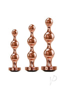 Gender X Gold Digger 3 Piece Anal Plug Set Rose Gold Black with graduated sizes and sparkling black gem bases.