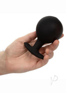 CalExotics Weighted Silicone Inflatable Plug Large Black held in hand, showcasing its design and size.