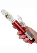 Naughty Bits Cumball Machine Thrusting Rabbit Vibrator Red held in hand with LED control pad.
