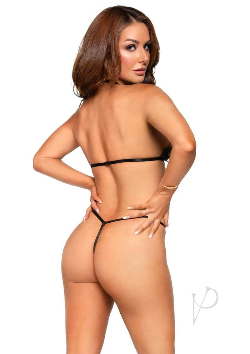 Model wearing a sheer black lingerie set featuring a bikini top and thong, showcasing a flirty and sexy style.