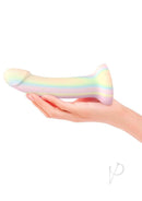 Dildolls Fantasia Silicone Dildo Glow In The Dark held in hand, showcasing its pastel rainbow design.