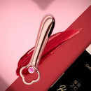 Omysky Heart Of The Ocean Bullet Vibrator with elegant design on a vibrant red surface.