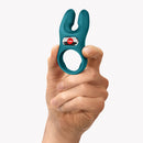 Hand holding Fun Factory Nos Classic Vibrating Cock Ring Green featuring dual-motor stimulation and ergonomic design.