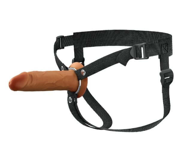 Brown 6" silicone hollow strap-on with adjustable harness, featuring a dual-density design for realistic and comfortable experiences.