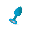 Gemma Clear Iridescent Gem Teal Silicone Anal Plug Large featuring a smooth teal body and clear gem.