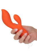 Stella Liquid Silicone Dual Teaser Vibrator Orange being held in hand, showcasing its ergonomic design.