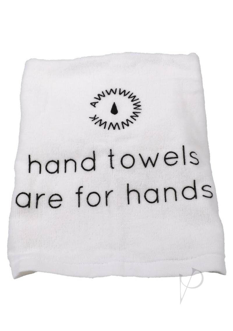 White hand towel with text "hand towels are for hands" and a minimalist logo above.