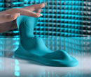 Bump N Grind Silicone Triple Bump Grinding Pad Blue displayed with hand to emphasize its texture and design features.