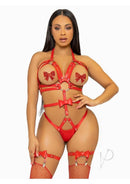 Leg Avenue Vegan Leather O-Ring Studded Harness Teddy Red showcased on a model, featuring bold red straps and studded embellishments.