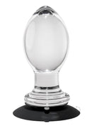 Gender X Crystal Ball Anal Plug Clear with a sleek, transparent design and suction base for hands-free pleasure.