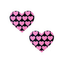 Neva Nude Pink Heart UV Black Glitter Heart Nipztix Pasties with playful pink hearts on a black glitter background.
