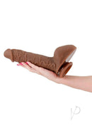 Shane Diesel Silicone Dual Dense Dildo Chocolate held in a hand showcasing its realistic design and size.