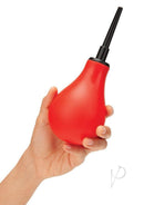 CleanScene Anal Douche Set Classic Flared Base Red held in a hand with a flared nozzle for easy use.