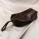 Edonista Venice 14 Piece Bondage Set brown bag with zipper on a smooth surface